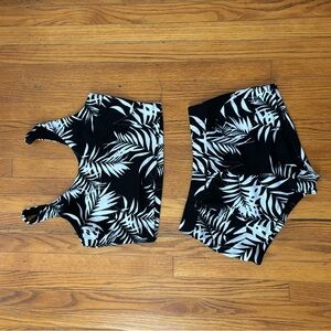 A tank top and shorts set. Black and white leaf pattern